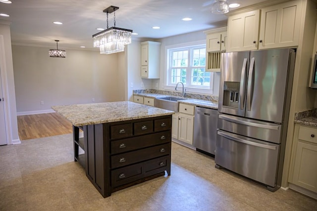 kitchen featuring a sink, stainless steel appliances, open shelves, light stone counters, and hanging light fixtures