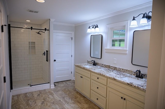 bathroom with crown molding, visible vents, a shower stall, and a sink