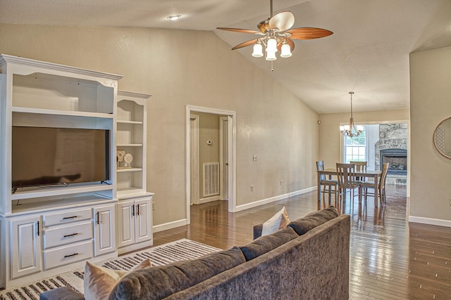 living area featuring high vaulted ceiling, ceiling fan with notable chandelier, dark wood-style floors, and baseboards