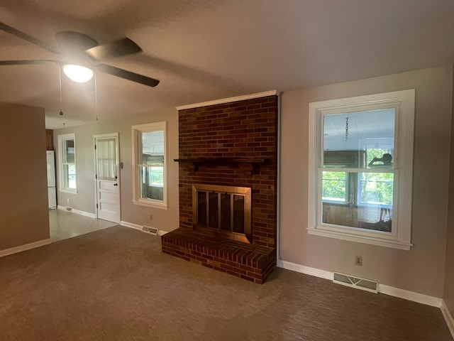 unfurnished living room with carpet floors, baseboards, and visible vents