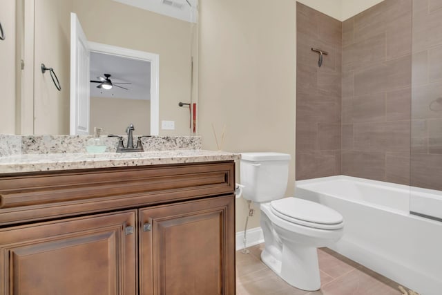 full bath with toilet, tile patterned flooring, ceiling fan, vanity, and shower / bathtub combination