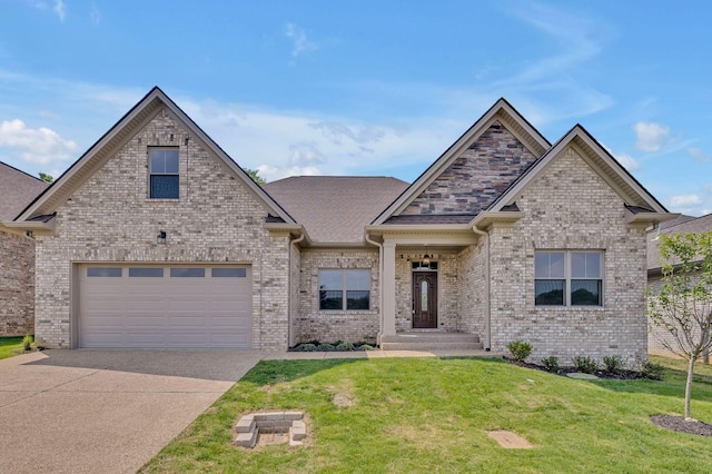 craftsman house featuring brick siding, driveway, and a front yard