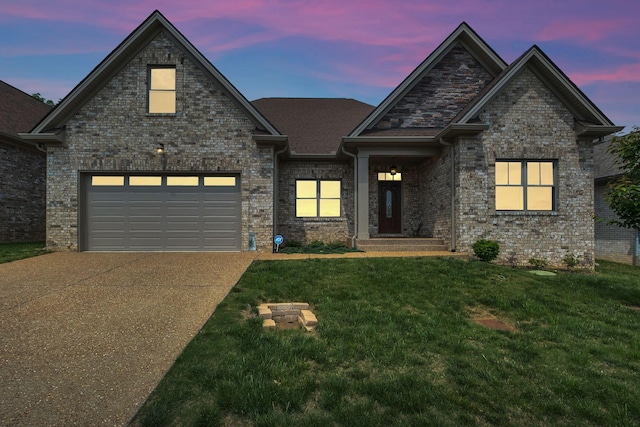 view of front of property with concrete driveway, a garage, and a lawn