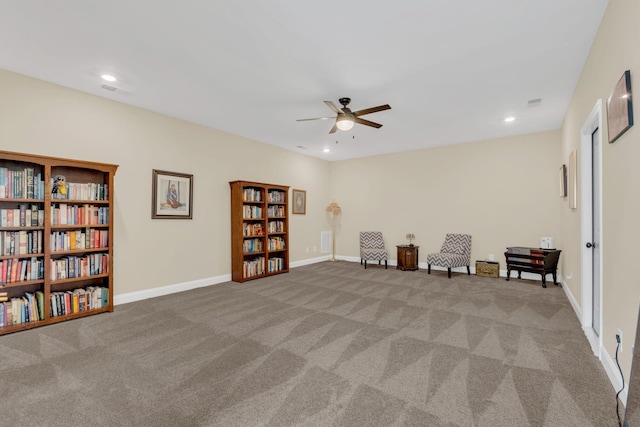 sitting room featuring carpet flooring, baseboards, a ceiling fan, and recessed lighting
