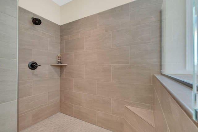 bathroom featuring tiled shower