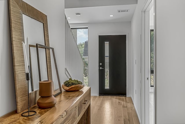 entrance foyer featuring light wood-type flooring, recessed lighting, and visible vents