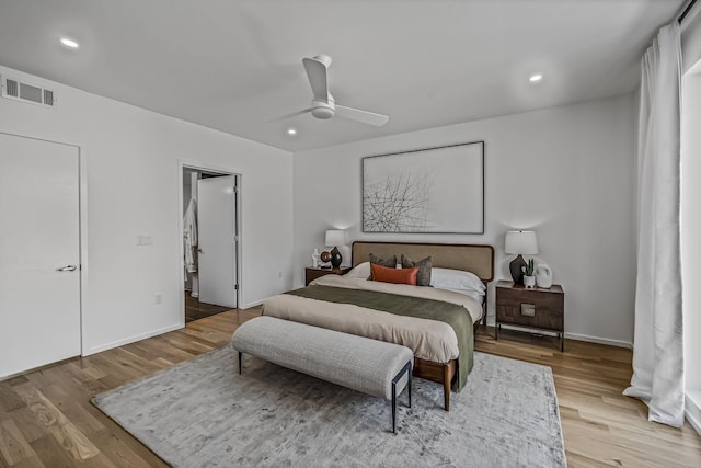 bedroom with visible vents, wood finished floors, and recessed lighting