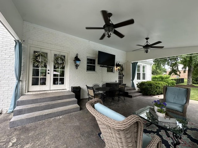 view of patio / terrace featuring entry steps, french doors, and a ceiling fan