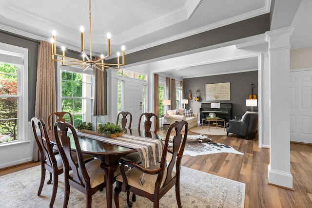 9404 Dove Field Ct, Brentwood, TN 37027 - dining room featuring plenty of natural light, ornate columns, and a notable chandelier