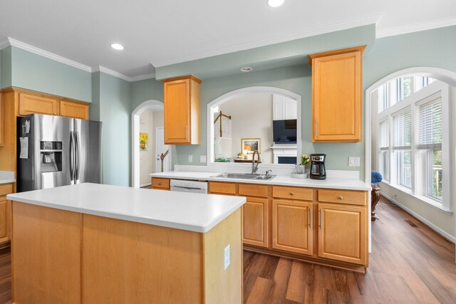 9404 Dove Field Ct, Brentwood, TN 37027 - kitchen featuring arched walkways, dark wood finished floors, a sink, and stainless steel refrigerator with ice dispenser