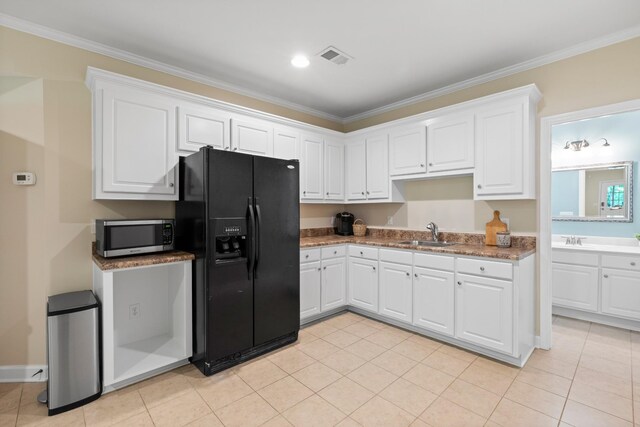 9404 Dove Field Ct, Brentwood, TN 37027 - kitchen with ornamental molding, stainless steel microwave, a sink, and black fridge