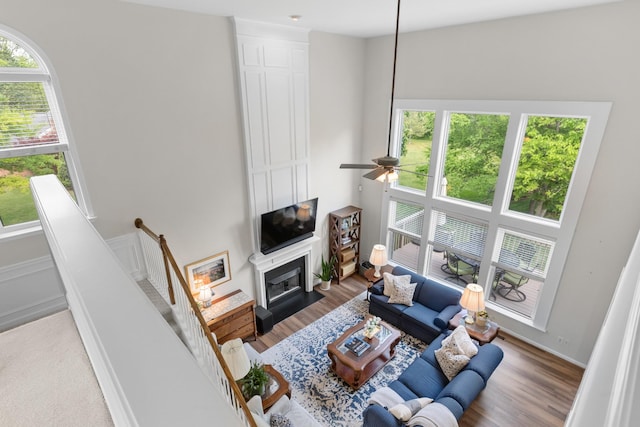9404 Dove Field Ct, Brentwood, TN 37027 - living area featuring a large fireplace, wood finished floors, and ceiling fan