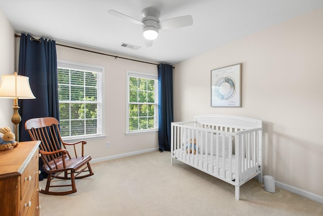 9404 Dove Field Ct, Brentwood, TN 37027 - bedroom with baseboards, a nursery area, ceiling fan, visible vents, and light carpet