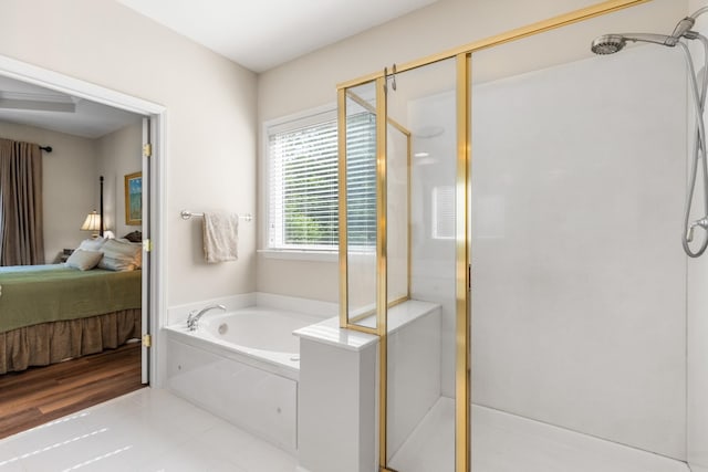 9404 Dove Field Ct, Brentwood, TN 37027 - ensuite bathroom featuring a stall shower, ensuite bath, a bath, and tile patterned floors