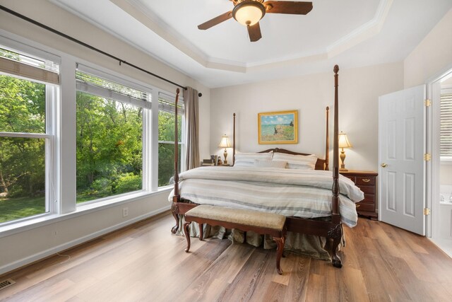 9404 Dove Field Ct, Brentwood, TN 37027 - bedroom featuring wood finished floors, visible vents, crown molding, a ceiling fan, and a tray ceiling
