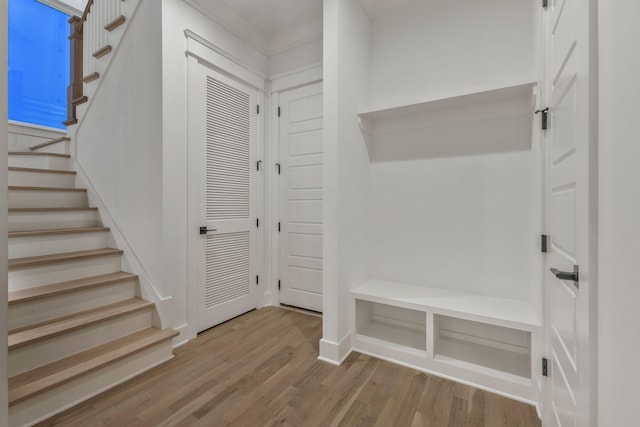 mudroom with baseboards and wood finished floors
