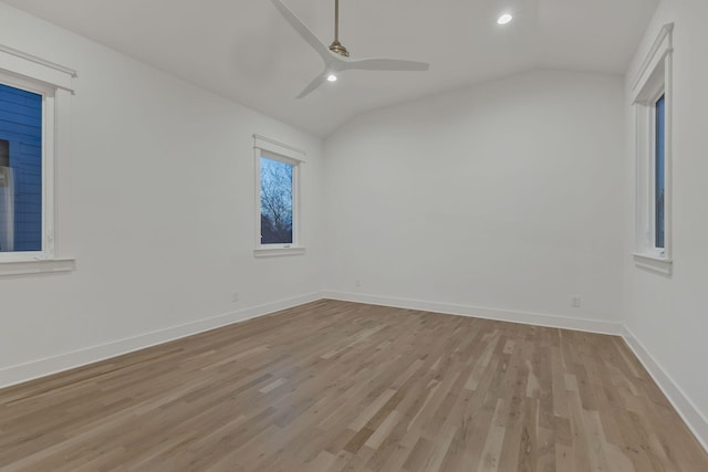 unfurnished room featuring a ceiling fan, recessed lighting, baseboards, light wood finished floors, and vaulted ceiling