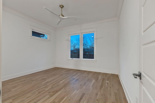 empty room with baseboards, ceiling fan, ornamental molding, and light wood-type flooring