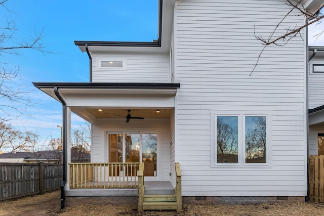 rear view of house featuring crawl space, a fenced backyard, and ceiling fan