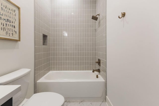 full bathroom with shower / bathing tub combination, toilet, marble finish floor, vanity, and baseboards