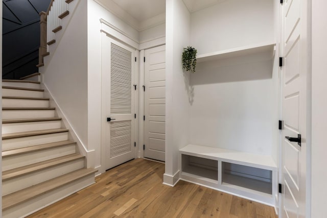 mudroom with baseboards and wood finished floors