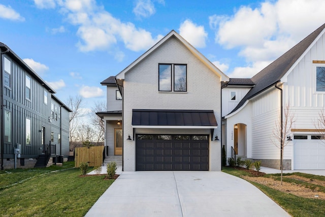 modern farmhouse style home with brick siding, concrete driveway, a garage, board and batten siding, and a standing seam roof