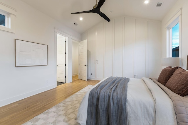bedroom featuring lofted ceiling, recessed lighting, light wood-style floors, and visible vents