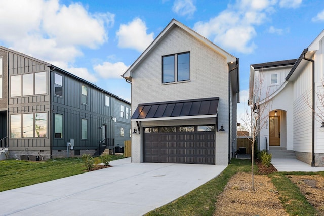 modern farmhouse style home featuring board and batten siding, brick siding, an attached garage, concrete driveway, and entry steps
