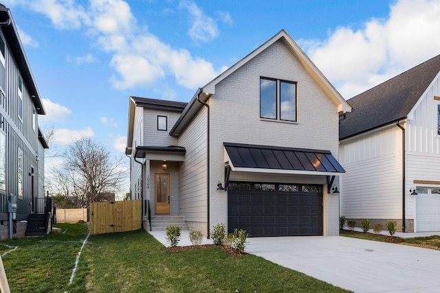 modern farmhouse with concrete driveway, a front yard, brick siding, and a garage