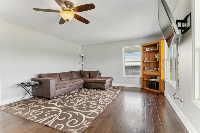 4 Earl Steel Rd W, Brush Creek, TN 38547 - living area with dark wood-type flooring, healthy amount of natural light, and baseboards
