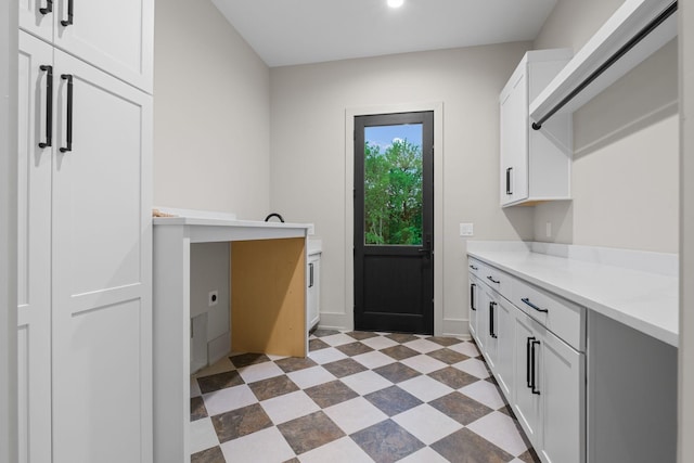 laundry room with baseboards, recessed lighting, and dark floors