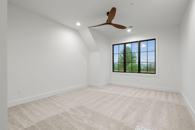 spare room with baseboards, recessed lighting, ceiling fan, and light colored carpet