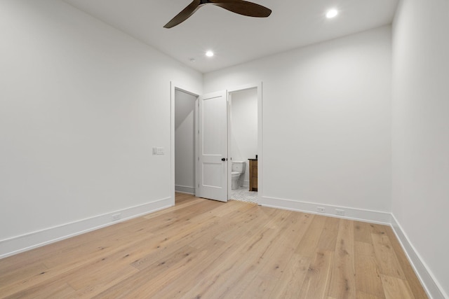 spare room with ceiling fan, baseboards, light wood finished floors, and recessed lighting
