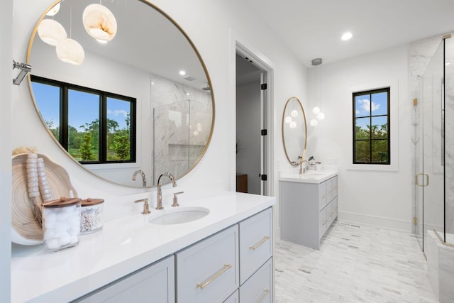 bathroom with recessed lighting, baseboards, a sink, two vanities, and a marble finish shower
