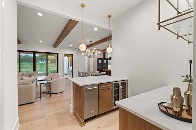 kitchen featuring open floor plan, light wood-type flooring, beamed ceiling, light countertops, and wine cooler