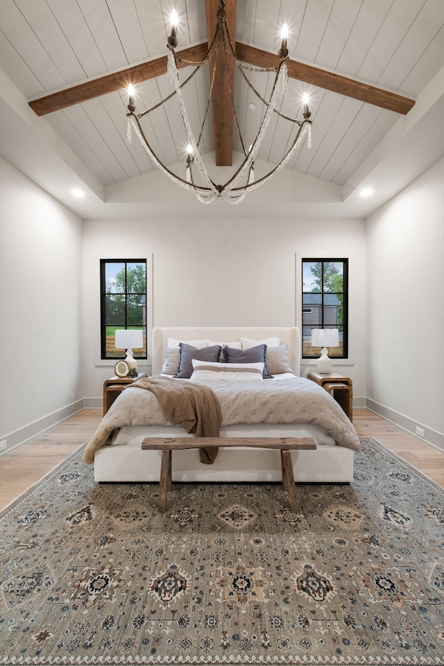 bedroom with multiple windows, wood ceiling, and light wood-style flooring