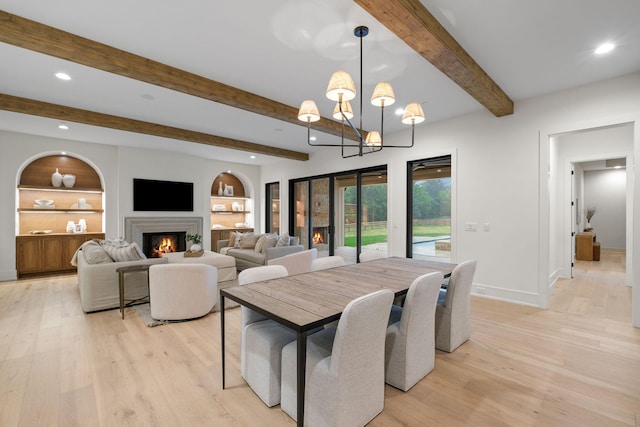 dining room with baseboards, light wood-style floors, and recessed lighting