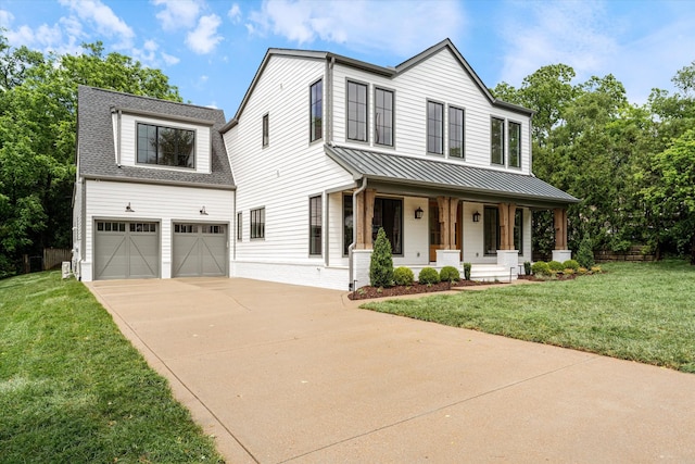 1408 Adams St, Franklin, TN 37064 - modern farmhouse featuring a porch, a garage, driveway, a standing seam roof, and a front yard