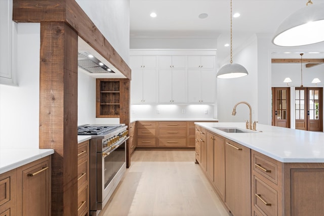 1408 Adams St, Franklin, TN 37064 - kitchen with double oven range, a sink, light wood-style floors, pendant lighting, and white cabinets
