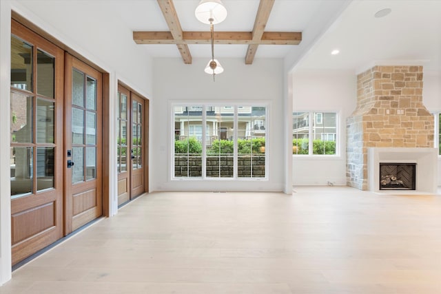 1408 Adams St, Franklin, TN 37064 - unfurnished living room featuring beamed ceiling, coffered ceiling, light wood-style floors, a stone fireplace, and recessed lighting