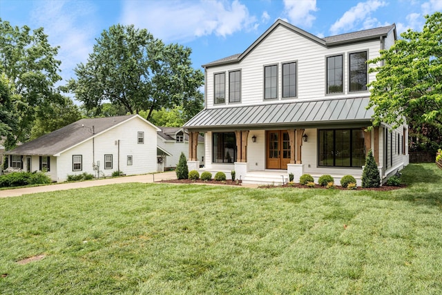 1408 Adams St, Franklin, TN 37064 - view of front of property with a standing seam roof, covered porch, a front yard, and roof with shingles
