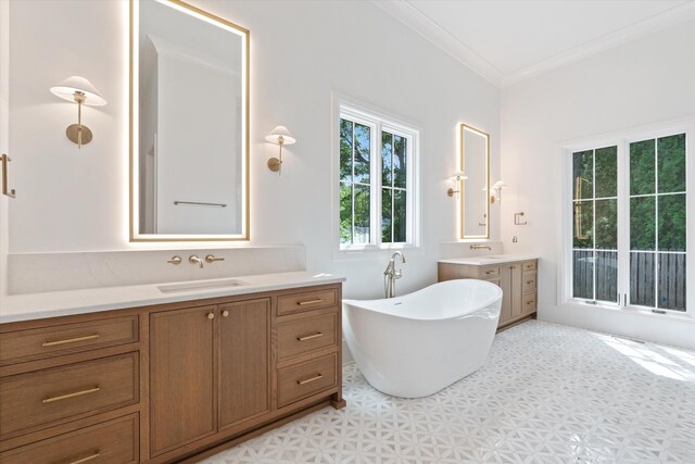 1408 Adams St, Franklin, TN 37064 - bathroom with tile patterned floors, ornamental molding, a soaking tub, and two vanities