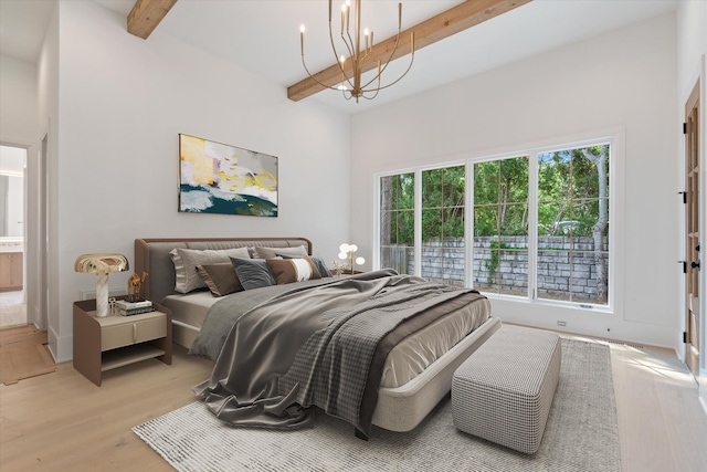 1408 Adams St, Franklin, TN 37064 - bedroom featuring a chandelier, beam ceiling, multiple windows, and light wood finished floors