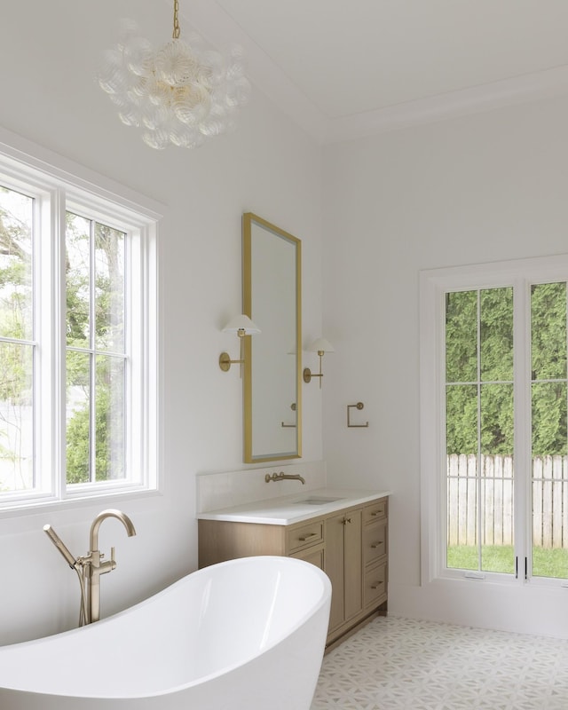 1408 Adams St, Franklin, TN 37064 - bathroom featuring vanity, a freestanding bath, and a chandelier