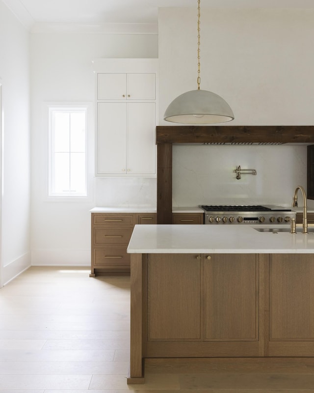 1408 Adams St, Franklin, TN 37064 - kitchen with light countertops, white cabinets, and decorative light fixtures