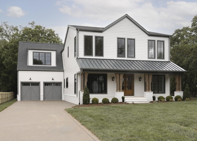 1408 Adams St, Franklin, TN 37064 - modern farmhouse with a porch, an attached garage, concrete driveway, a standing seam roof, and a front lawn