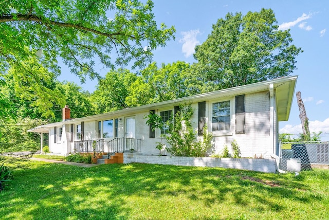 1872 River Rd, Clarksville, TN 37040 - ranch-style home with brick siding and a chimney
