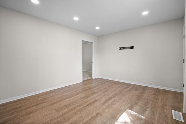 1872 River Rd, Clarksville, TN 37040 - spare room featuring wood finished floors, recessed lighting, and baseboards