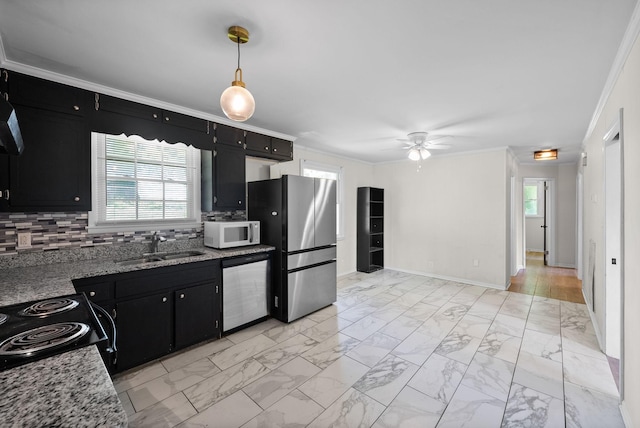 1872 River Rd, Clarksville, TN 37040 - kitchen with appliances with stainless steel finishes, dark cabinetry, ceiling fan, light marble finish floors, and a sink
