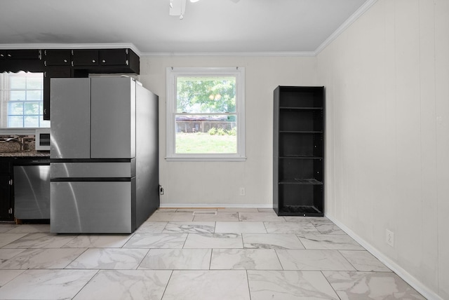 1872 River Rd, Clarksville, TN 37040 - kitchen featuring stainless steel appliances, dark cabinets, light marble finish flooring, crown molding, and healthy amount of natural light